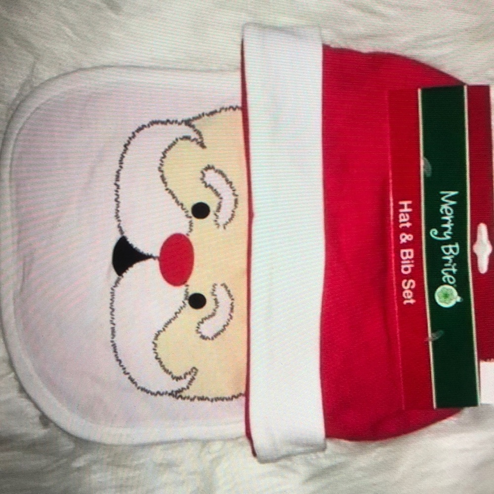 Merry Brite Santa’s face Baby hat Bib set new never worn